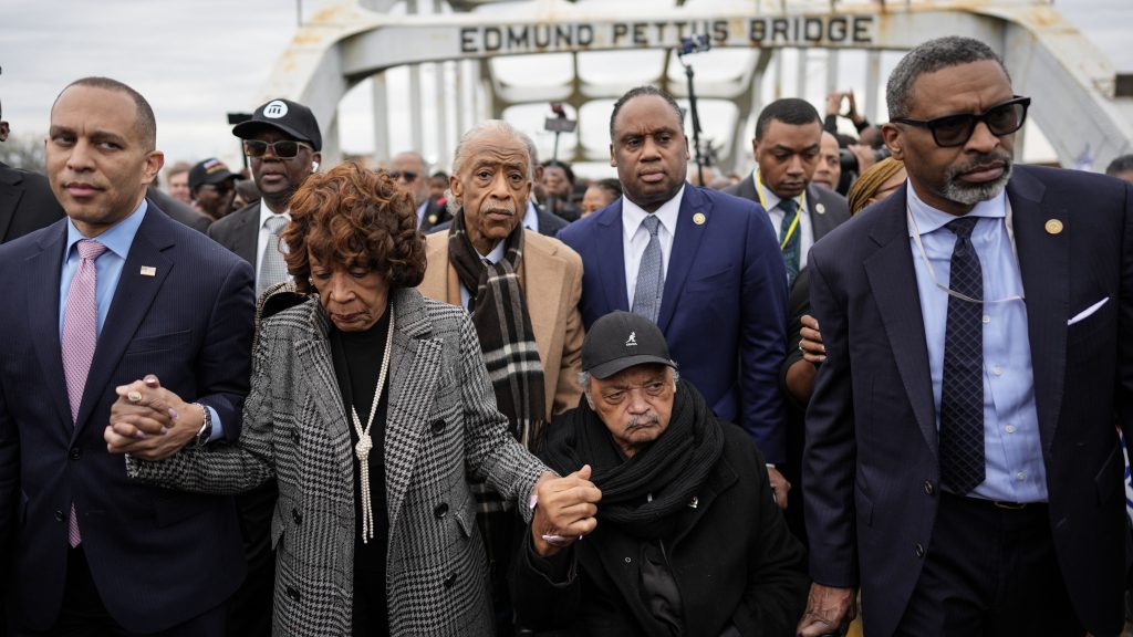 U.S. Rep. Hakeem Jeffries, D-NY, U.S. Rep. Maxine Waters, D-Calif., Rev. Al Sharpton, Rev. Jesse Jackson and NAACP President Derick Johnson, from left, march across the Edmund Pettus bridge during the 60th anniversary of the march to ensure that African Americans could exercise their constitutional right to vote, Sunday, March 9, 2025, in Selma, Ala.