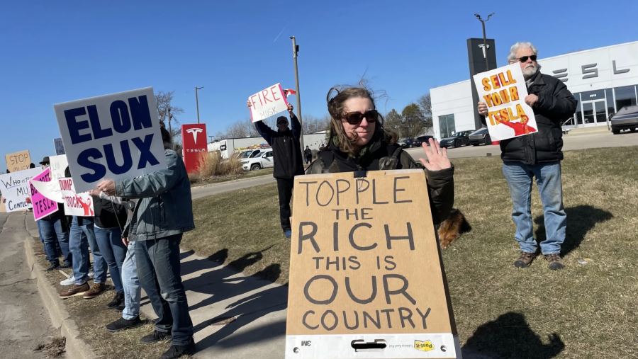 Protesters outside a Tesla showroom in Kentwood, Michigan on Monday, March 10, 2025.