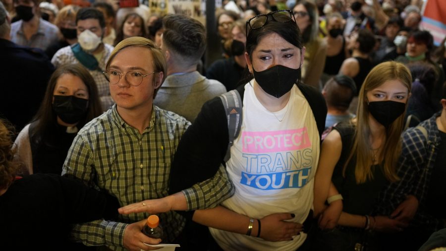 Protesters fill the Iowa state Capitol to denounce a bill that would strip the state civil rights code of protections based on gender identity, Thursday, Feb. 27, 2025, in Des Moines, Iowa.