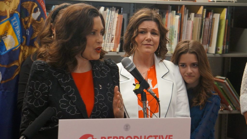 FILE - Gov. Gretchen Whitmer speaks at the bill signing ceremony last year of legislation to lift the state’s ban on paid surrogacy contracts.