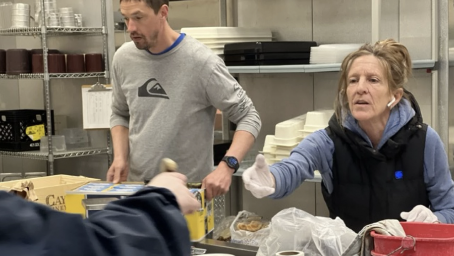 Susan Graham and other volunteers work to prepare hot meals April 3 at Shay Elementary School — which was converted to a warming station following the 2025 ice storm.