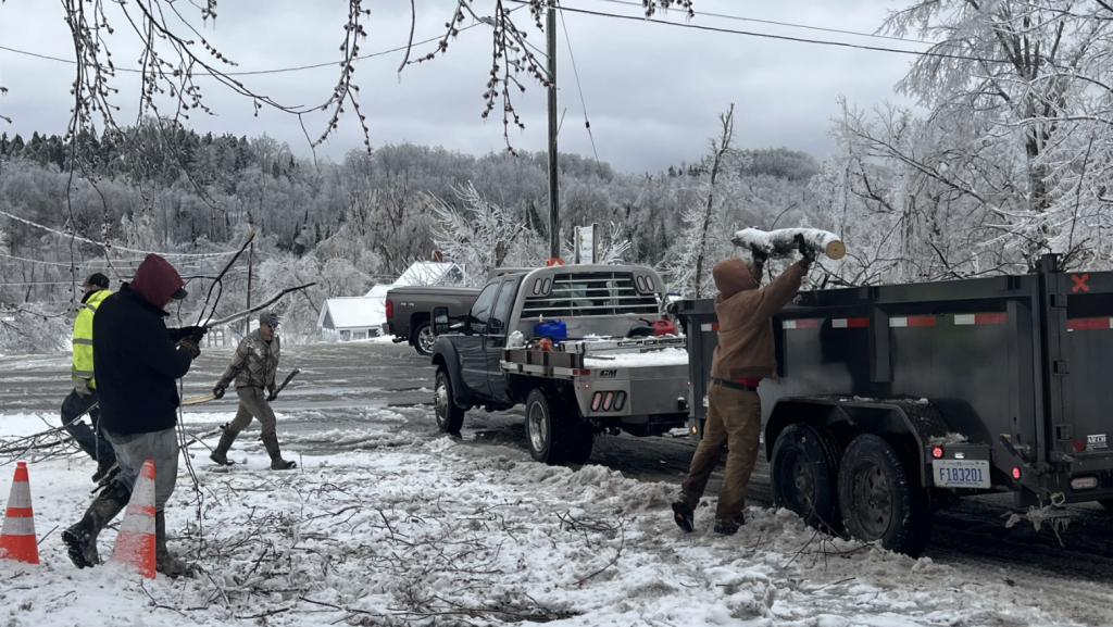Village employees clear debris left behind by historic ice storms in Wolverine on Monday, April 1, 2025.
