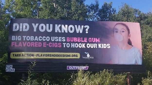 Billboard that reads, "Did you know? Tobacco used bubble gum flavored e-cigs to hook our kids"