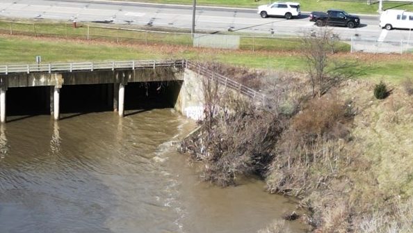 Sewage fills the Red Run Drain after a heavy rain on April 2, 2025.