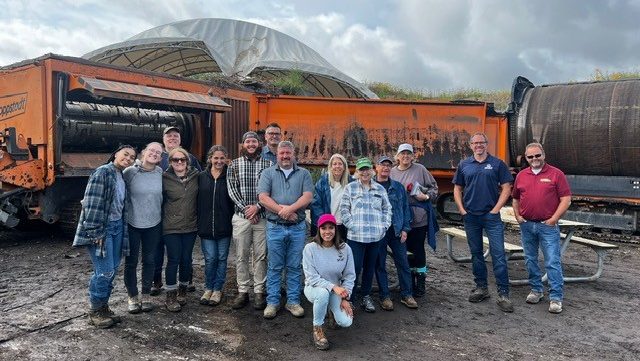 A photo of a group touring Spurt's compost facility in Wixom.