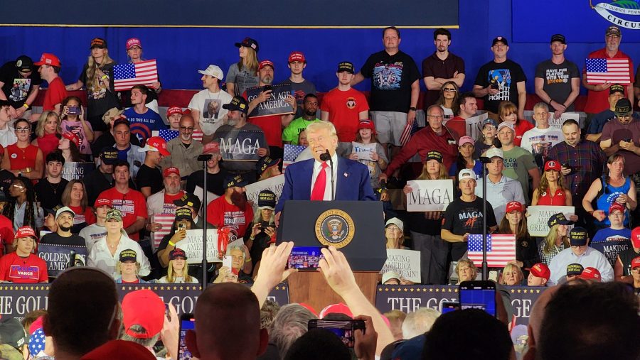 Trump speaks to a crowd of supporters at Macomb County, marking 100 days into his presidency, April 29, 2025.