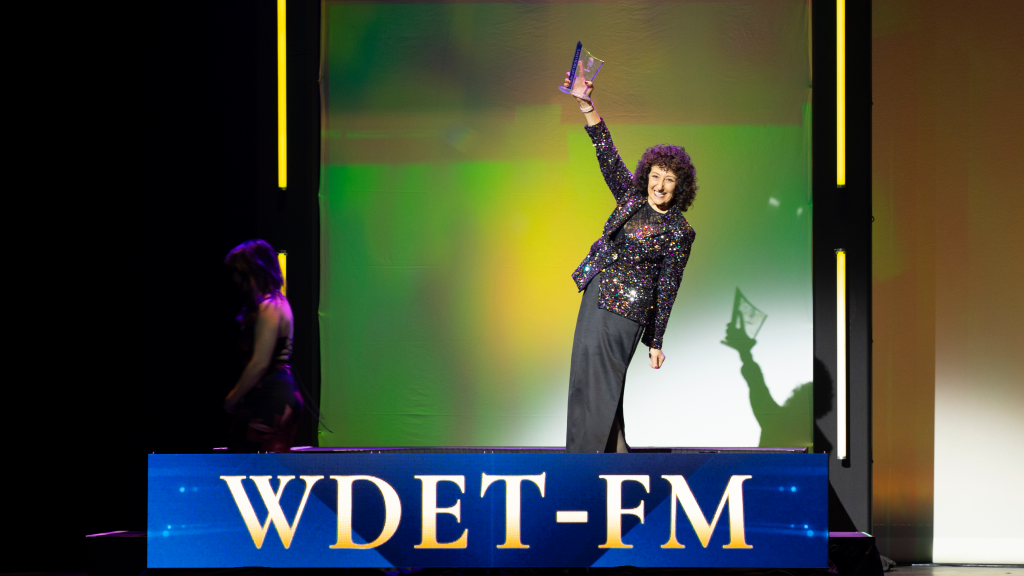 WDET General Manager Mary Zatina celebrates on stage at the MAB Broadcast Excellence Awards Gala on Saturday, April 5, 2025.