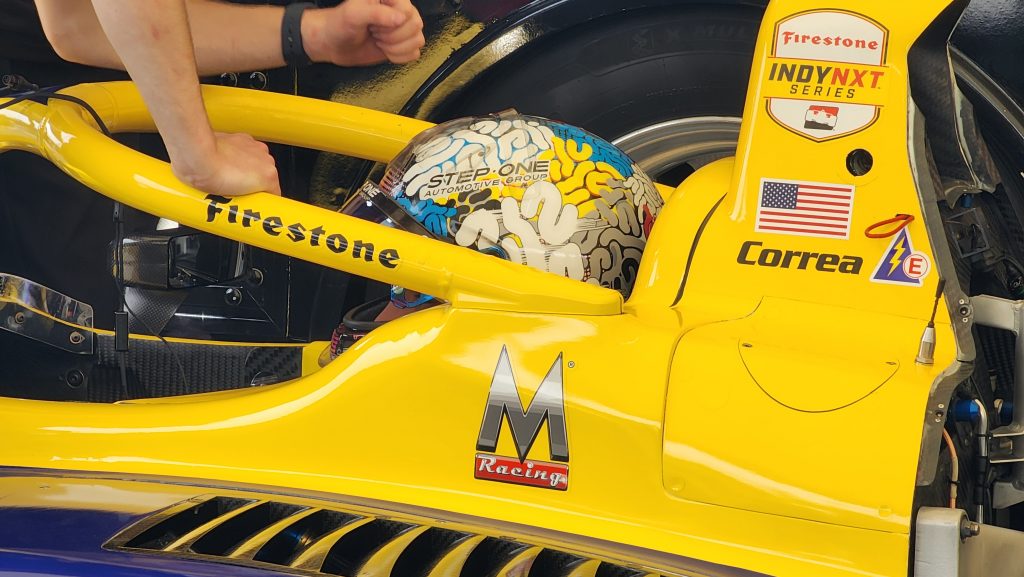 Driver Juan Manuel Correa gets set upu in his race car
