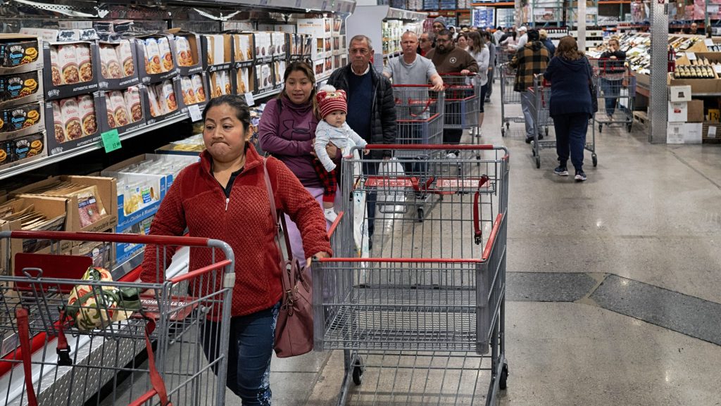 FILE - Customers wait in line for eggs at a Costco store in the Van Nuys section of Los Angeles on Wednesday, Feb. 19, 2025.