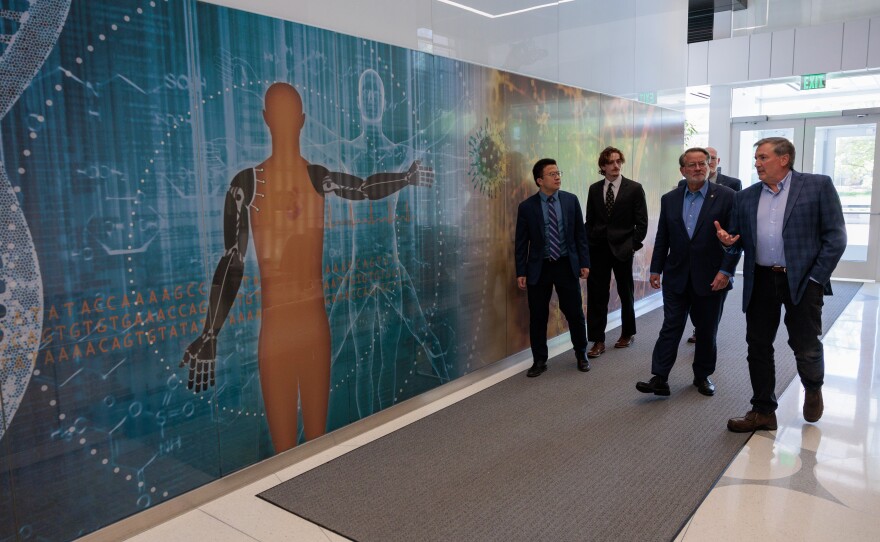 U.S. Sen. Gary Peters, third from left, tours the Institute for Quantitative Health Science and Engineering at Michigan State University in East Lansing, May 16, 2025.