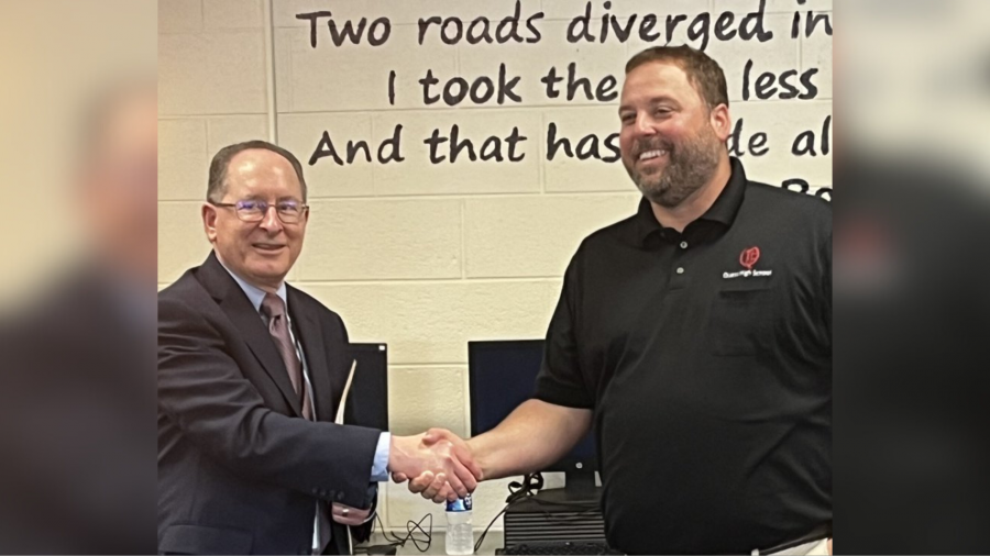 Cory Rosser accepting his accolades from the Michigan Department of Education.