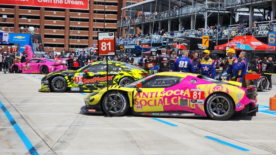 Cars sit on pit lane before the IMSA SportsCar Championship race in Detroit.