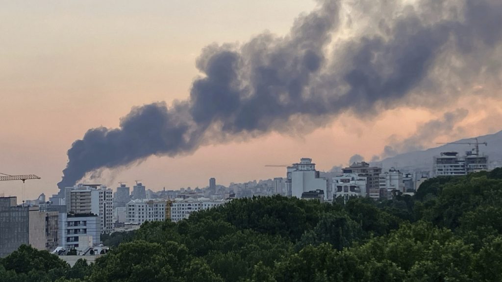 Smoke rises from the building of Iran's state-run television after an Israeli strike in Tehran, Iran, Monday, June 16, 2025.