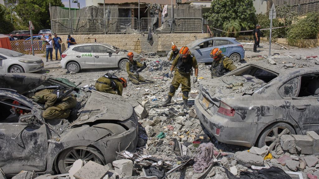 Israeli soldiers work amid the rubble of residential buildings destroyed by an Iranian missile strike that killed several people, in Beersheba, Israel, on Tuesday, June 24, 2025.