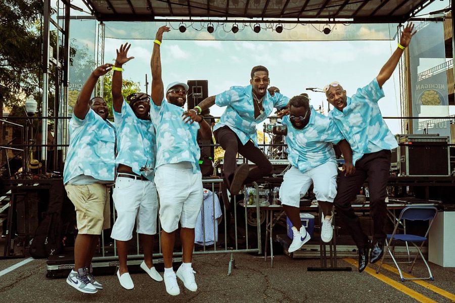 Drey Skonie and the Klouds backstage at an outdoor concert