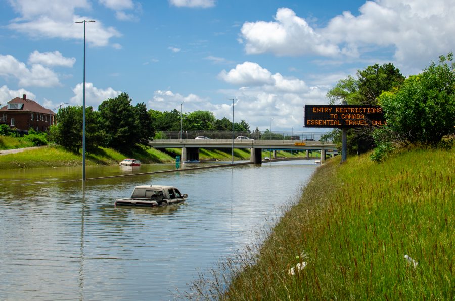 A truck is submerged in a flooded road.