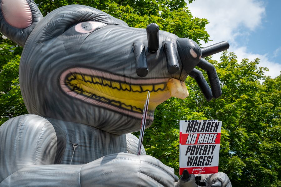 Health care workers strike outside of McLaren Macomb Hospital on July 8, 2025, over staffing and pay dissatisfaction.