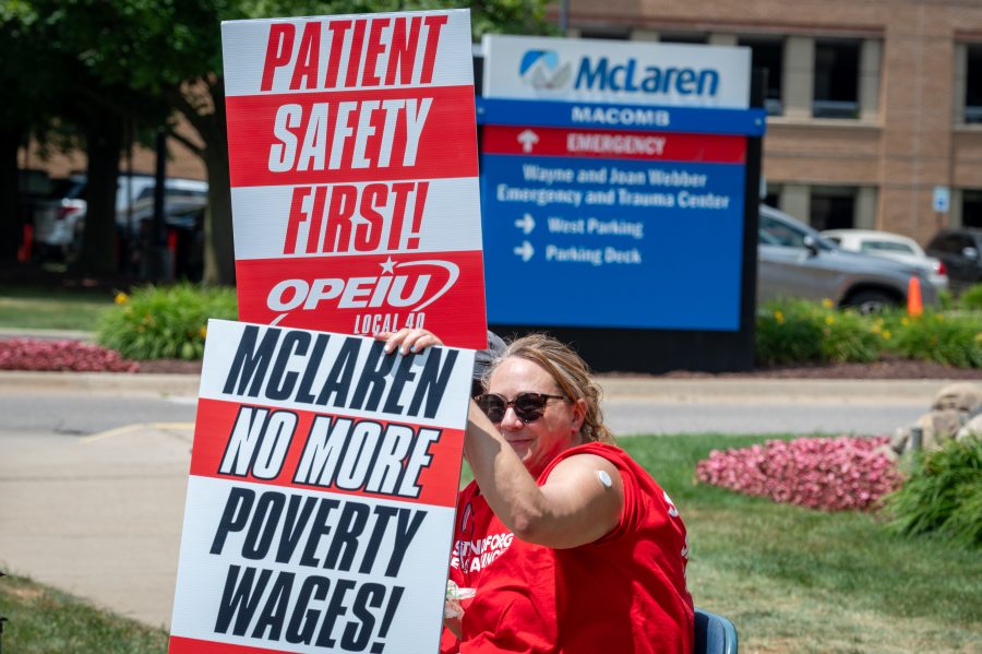 Health care workers strike outside of McLaren Macomb Hospital on July 8, 2025, over staffing and pay dissatisfaction.