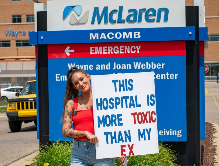 Health care workers strike outside of McLaren Macomb Hospital on July 8, 2025, over staffing and pay dissatisfaction.