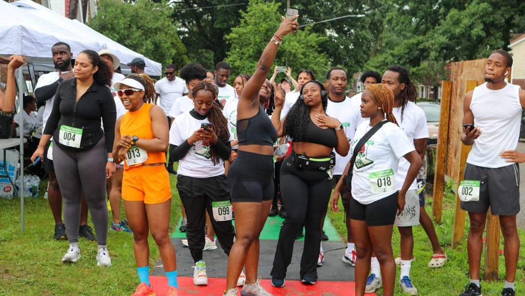 Racers wait at the start of the 7-2 Day 5K in Detroit's Hubbell-Puritan neighborhood.