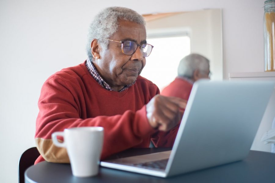 Older adult using a laptop