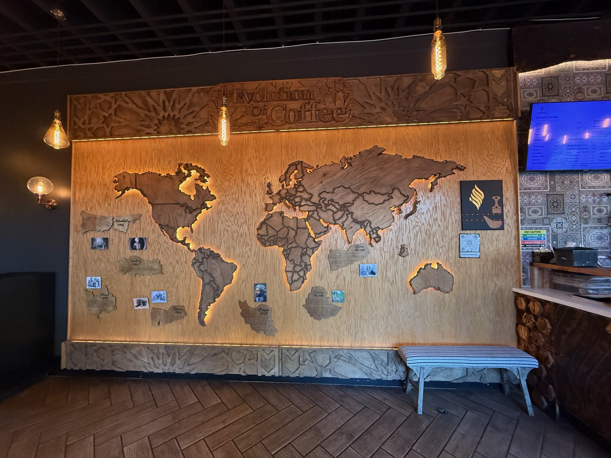 A wooden map showing the evolution of coffee over history