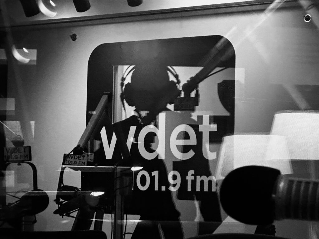 Big Sonic Heaven photo playing with shadow, reflection, and silhouette in grayscale.