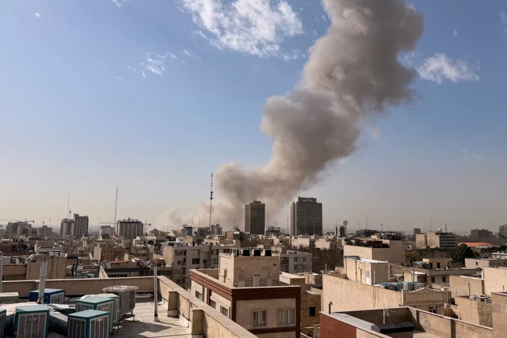 Smoke rises on the skyline after an explosion in Tehran, Iran