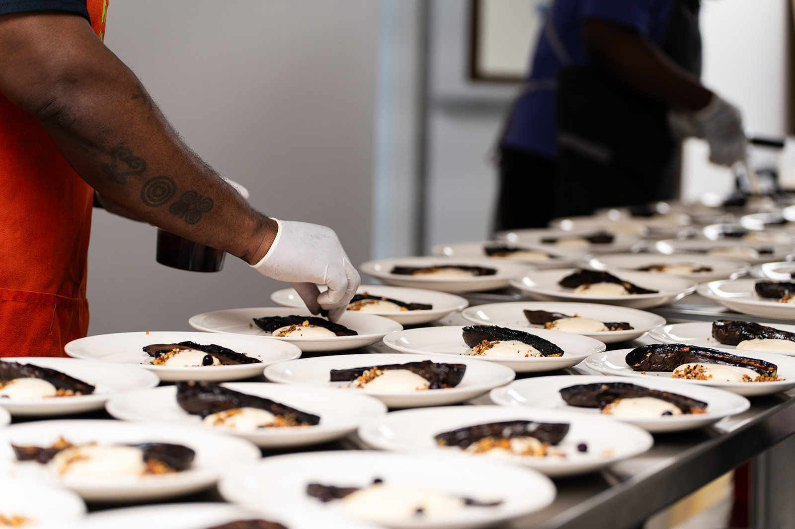 Caterer's plating dishes on a counter