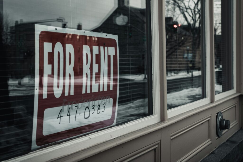 For Rent sign in a window.