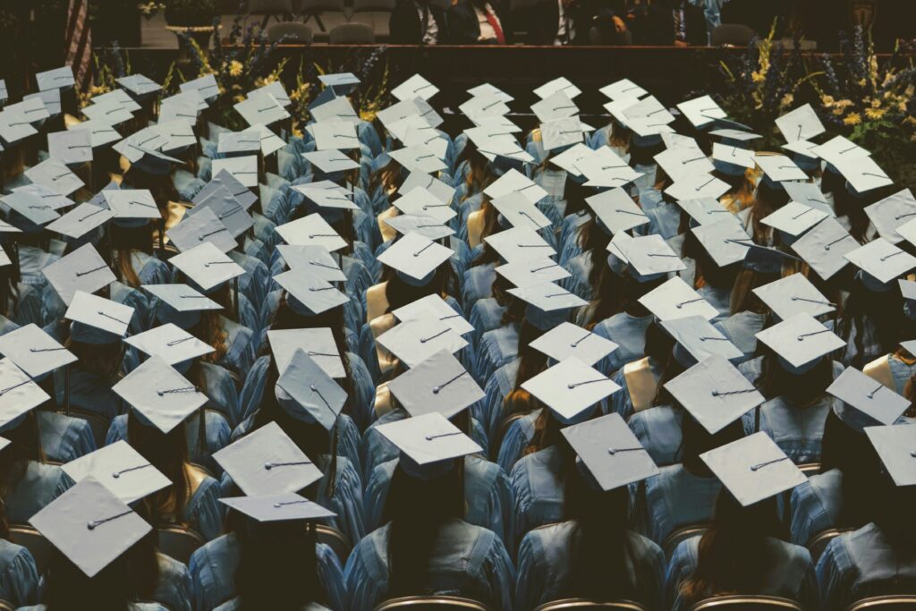 Rows of students wearing graduation caps.
