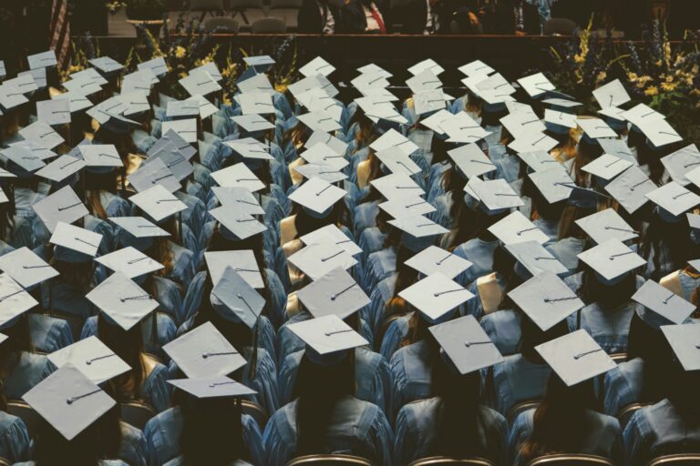Rows of students wearing graduation caps.