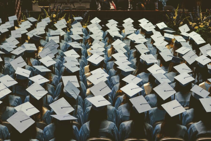 Rows of students wearing graduation caps.